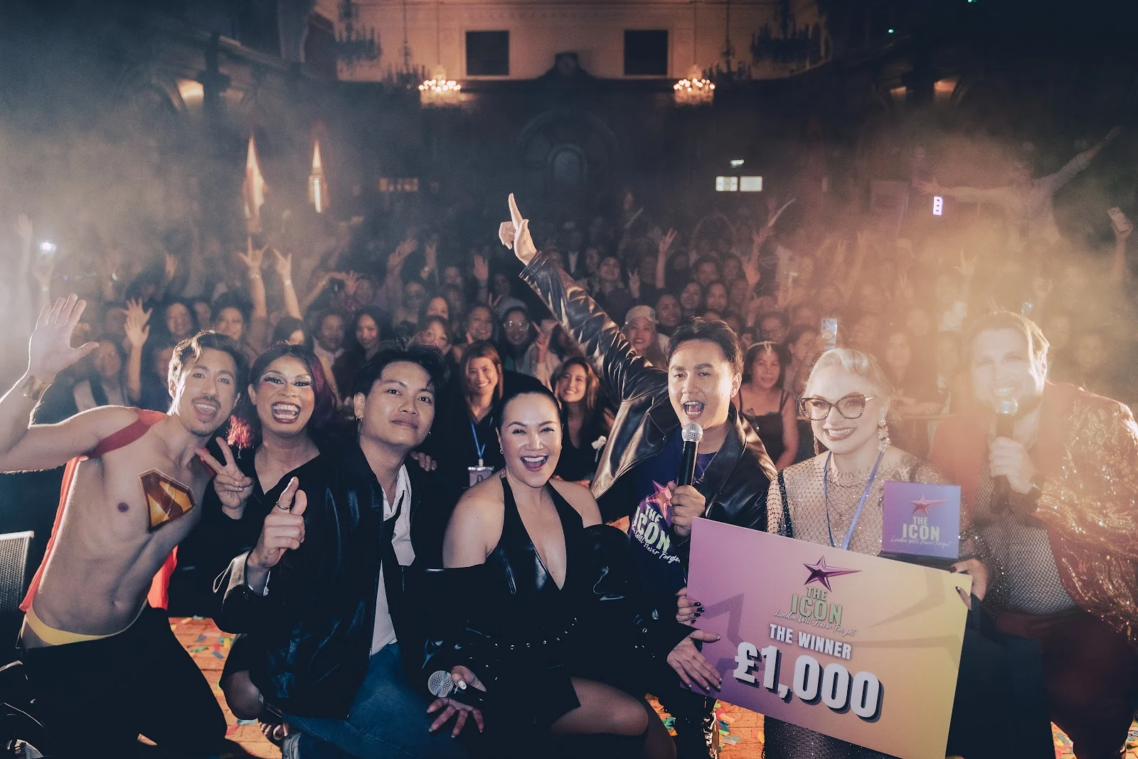 The winner and performers celebrating the £1,000 crown prize